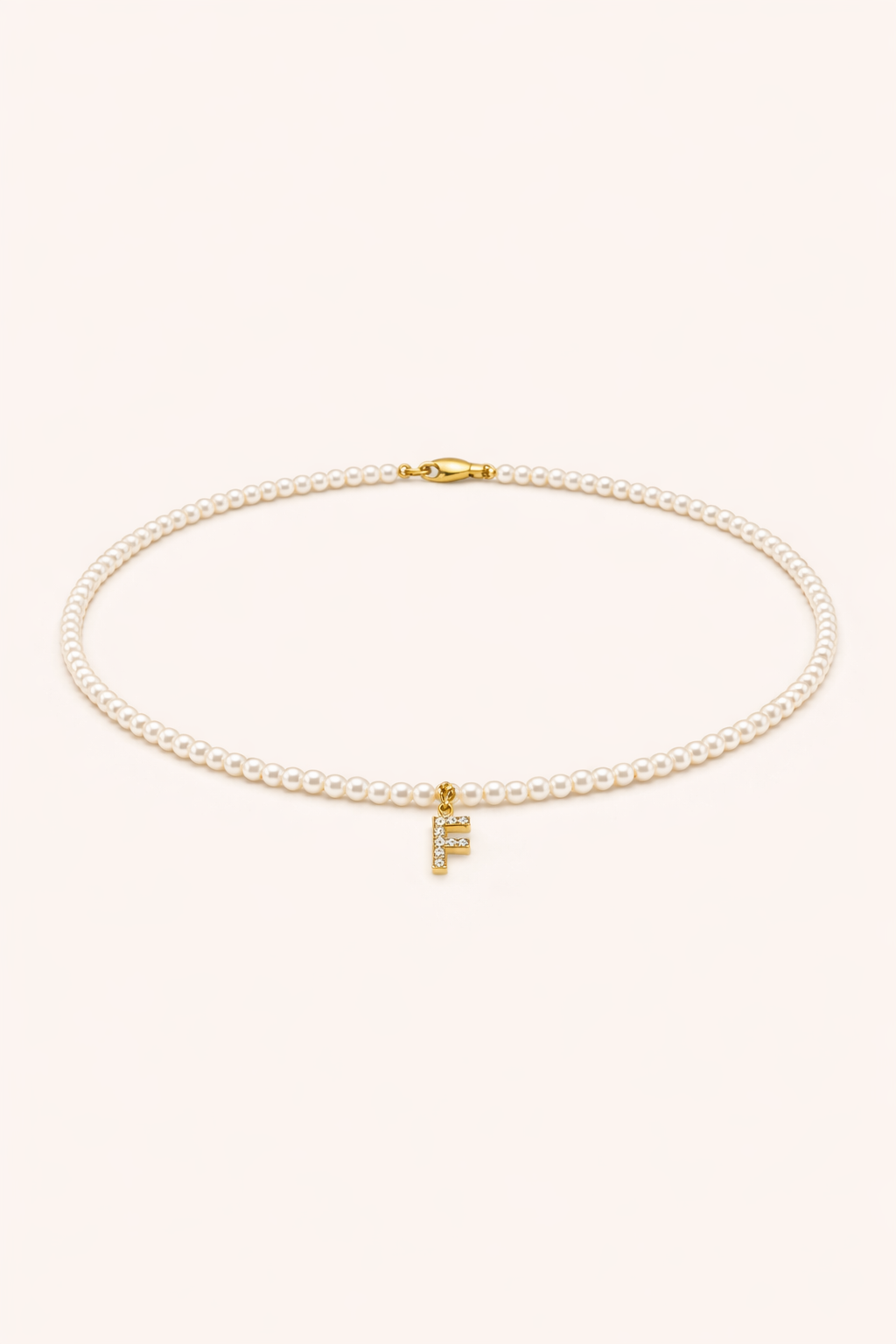 Collana Micropearl Initial — Packshot collana di perline con ciondolo lettera F